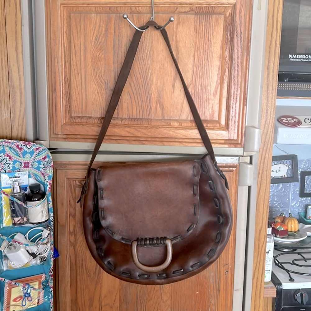 Genuine, saddle, leather hippie purse I am in love with.